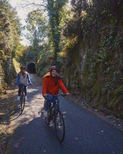 Two Cyclists in a wooded area